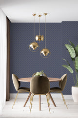 A room with navy blue Art Deco style wallpaper with intricate golden geometric patterns, giving the space an elegant, vintage ambiance indicative of traditional wallpaper.