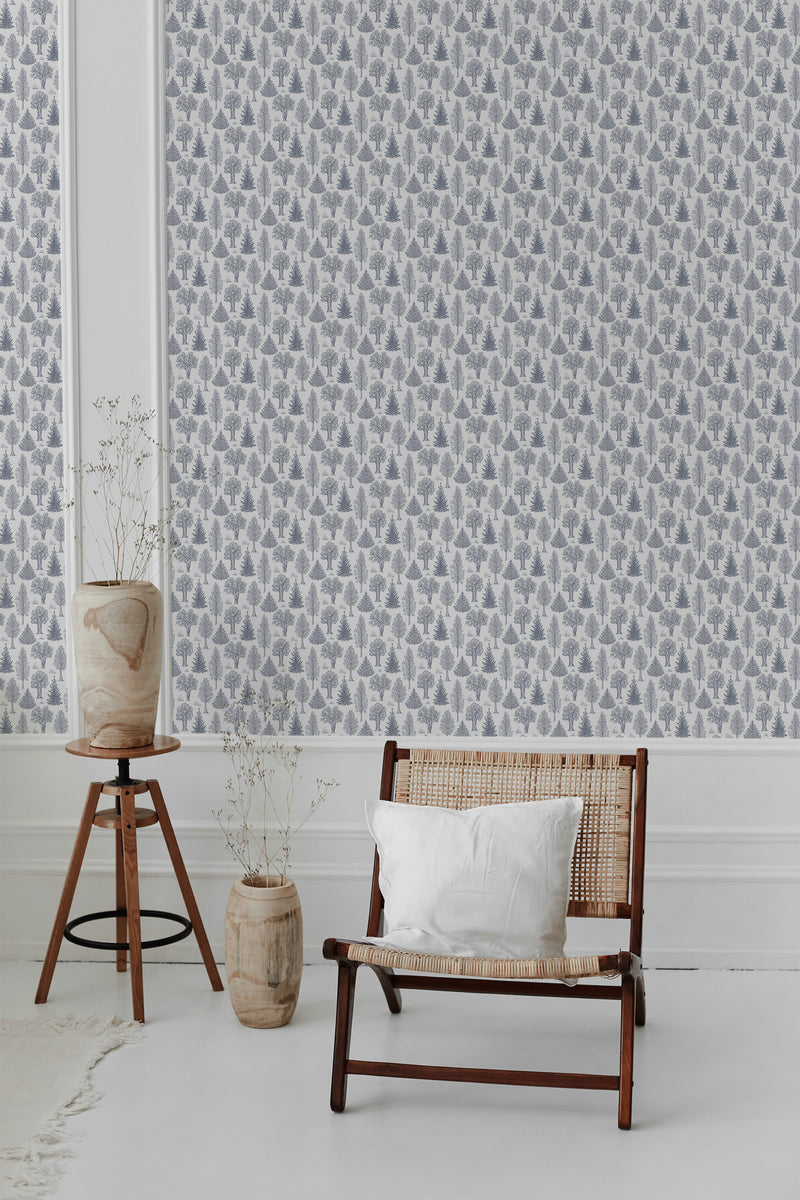 A room with Light Aesthetic Trees wallpaper design, showcasing a pattern of delicate trees on a light background, complementing a modern chair and a wooden floor lamp, traditional wallpaper.