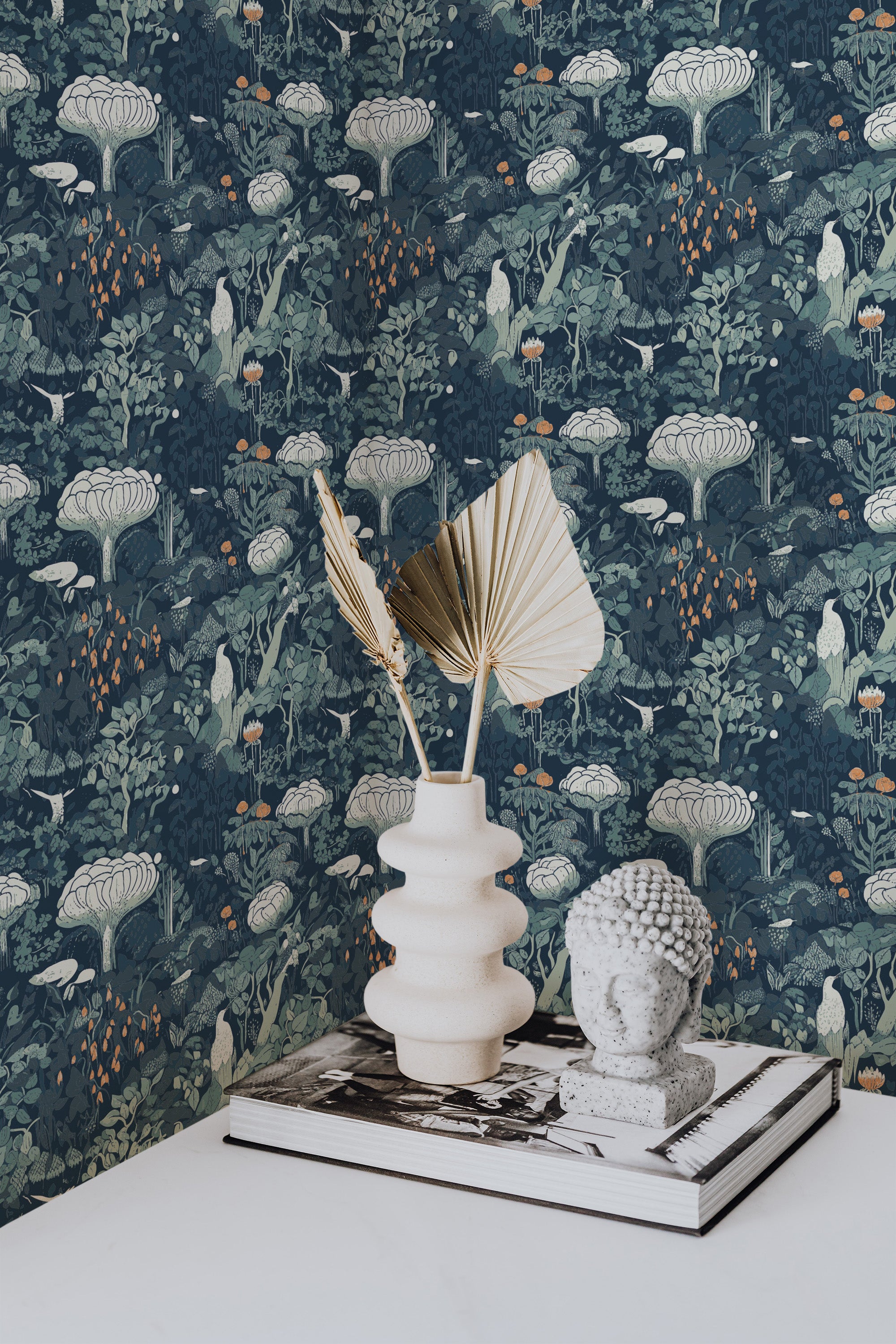 Self-adhesive Beautiful Midnight Meadow wallpaper with a dark blue background and a pattern of green foliage and white florals, decorated with gold accents.