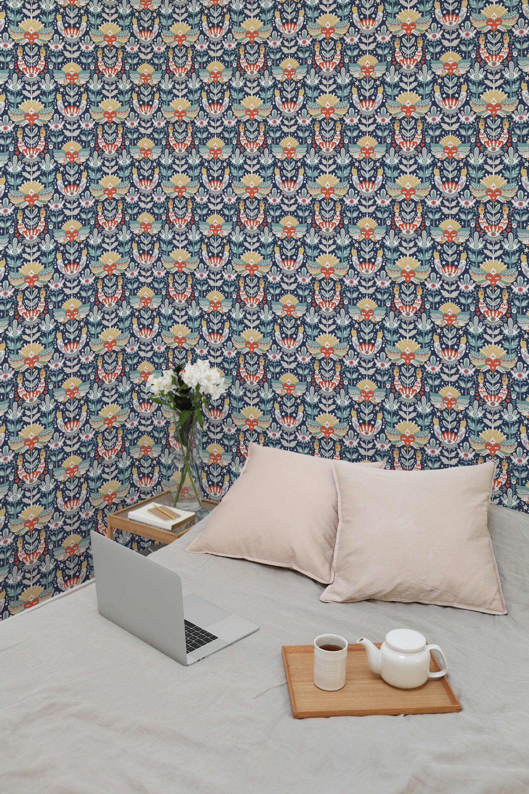 Self-adhesive Tarot Style wallpaper with intricate patterns and mystical motifs in a room with a laptop, cushion, and tea set on the bed.