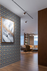 A room with ornate tarot-style wallpaper, incorporating intricate patterns and symbolic imagery reminiscent of tarot cards, against which hangs a framed artwork, in a space complemented by modern furnishings and wooden accents, traditional wallpaper.