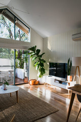 minimalist house terrace green plants living room honey herringbone stick and peel wallpaper