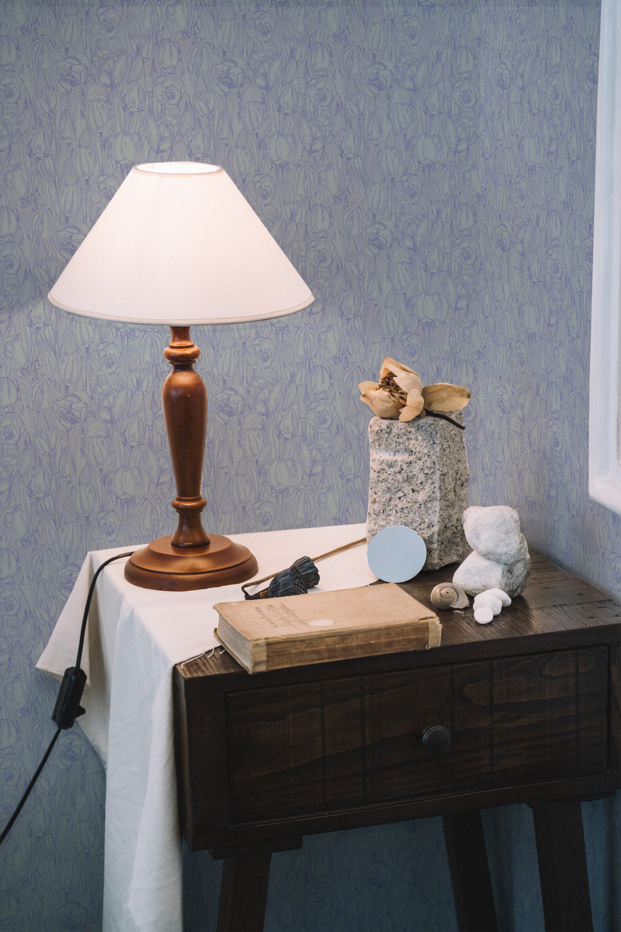 Self-adhesive Blue Tulip wallpaper with floral patterns in a room, accompanied by a wooden desk, table lamp, and decorative objects.