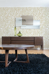 A modern room with Honey Abstract Doodles wallpaper design, interlocking white lines on a muted backdrop with a mid-century wooden table in front, traditional wallpaper.