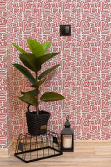 Self-adhesive wallpaper with a red and white abstract thin brush line pattern in a room with a potted plant and lantern on the floor.