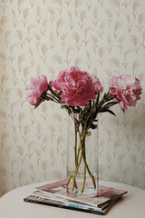 Self-adhesive wallpaper with a repeating pattern of soft warm beige and pink boho-style foliage on a neutral background.