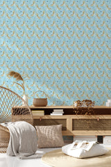 A light blue wallpaper with a repetitive pattern of golden tigers and foliage adorning the wall of a cozy room, titled 'Tigers on Blue', a traditional wallpaper.