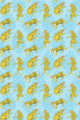 Vibrant blue background with a repeated pattern of yellow and black striped tigers, some lounging and others playful, in a tropical setting with green foliage, peel and stick removable wallpaper.