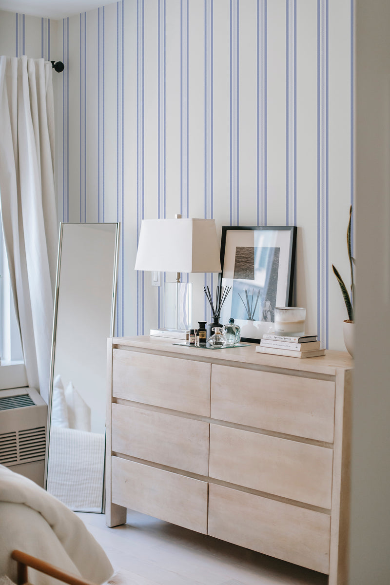         
peel and stick wallpaper classic blue french stripes accent wall bedroom dresser mirror minimalist interior