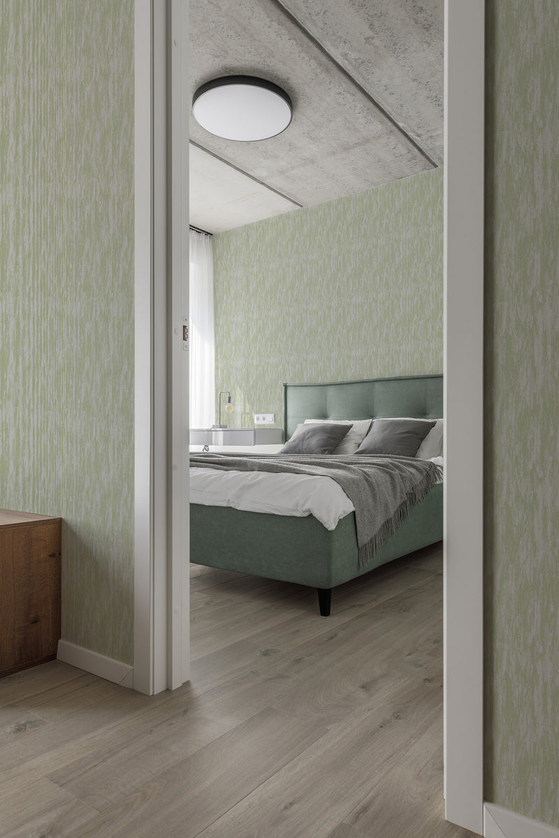 modern bedroom cushions concrete ceiling subtle gray and green accent wall