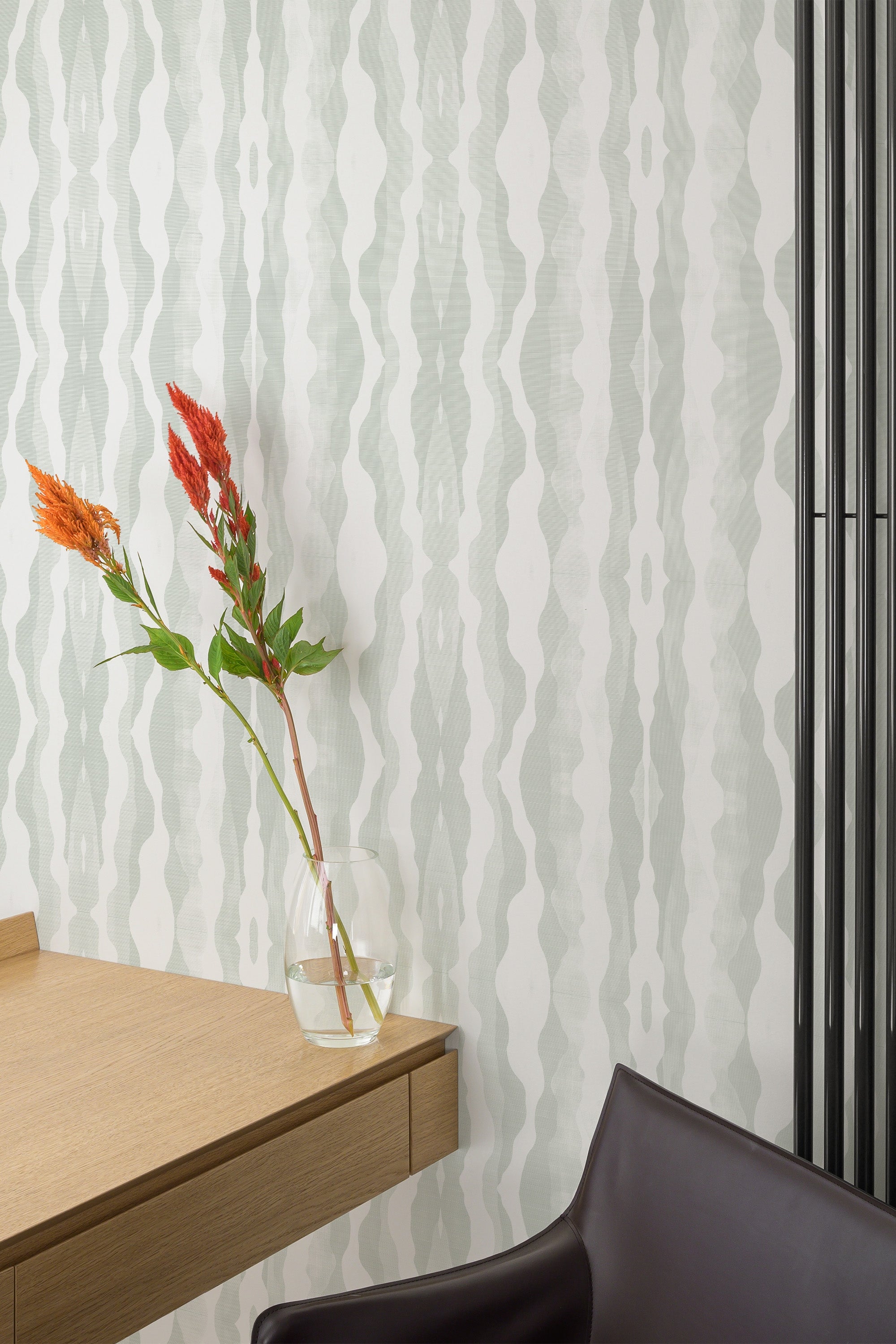 home office desk chair flower interior subtle symmetrical green accent wall