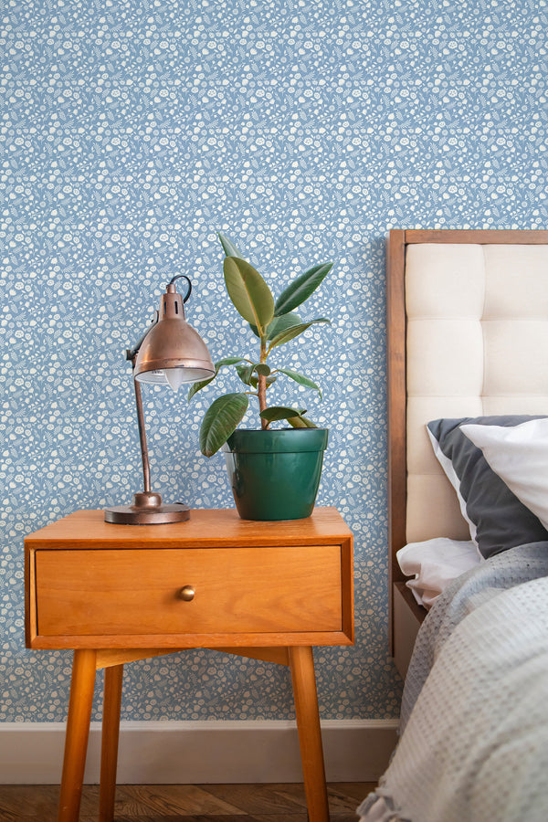 stylish bedroom interior nightstand plant lamp blue and white florals accent wall