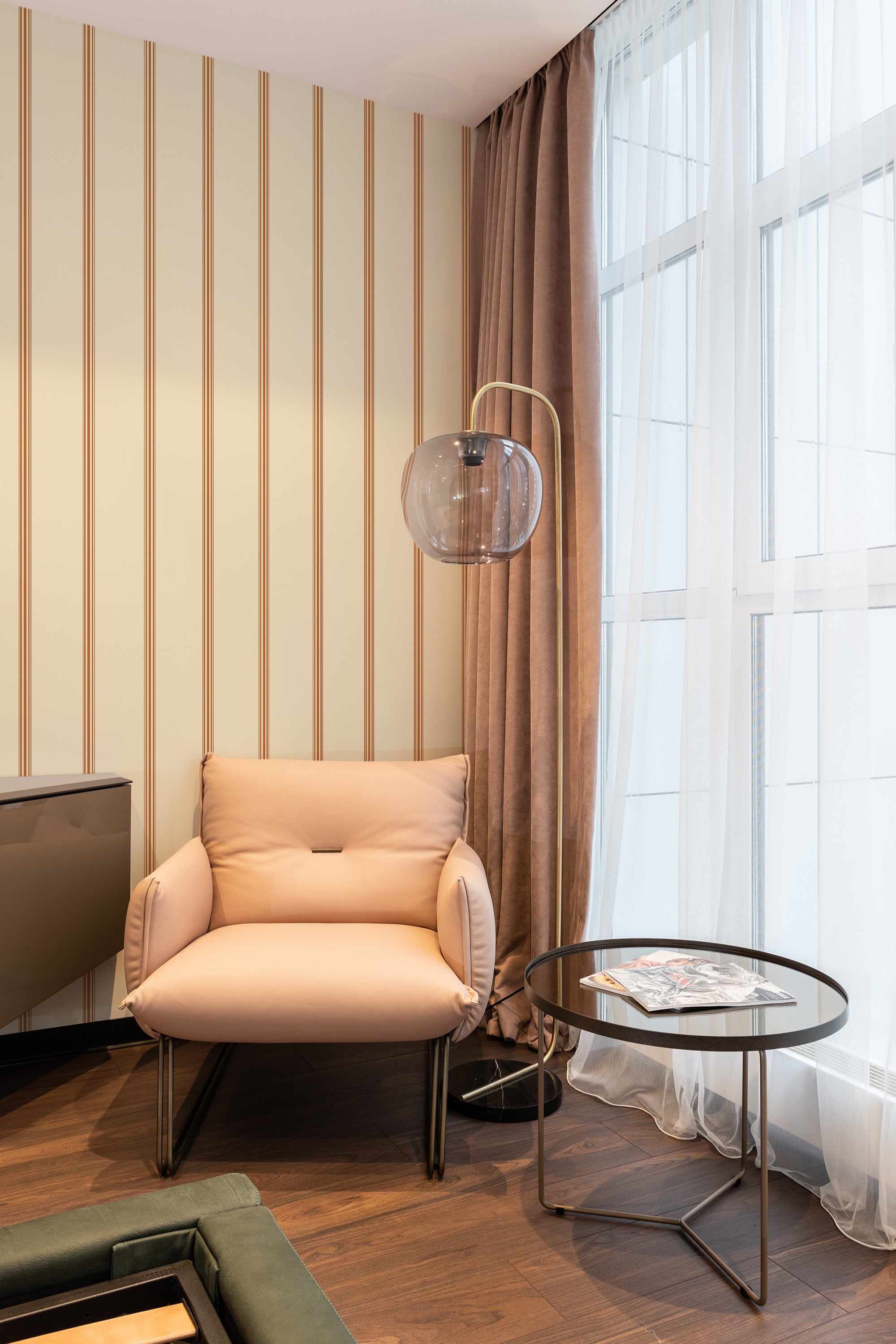 wallpaper stick and peel warm french stripes pattern modern armchair lamp table reading area