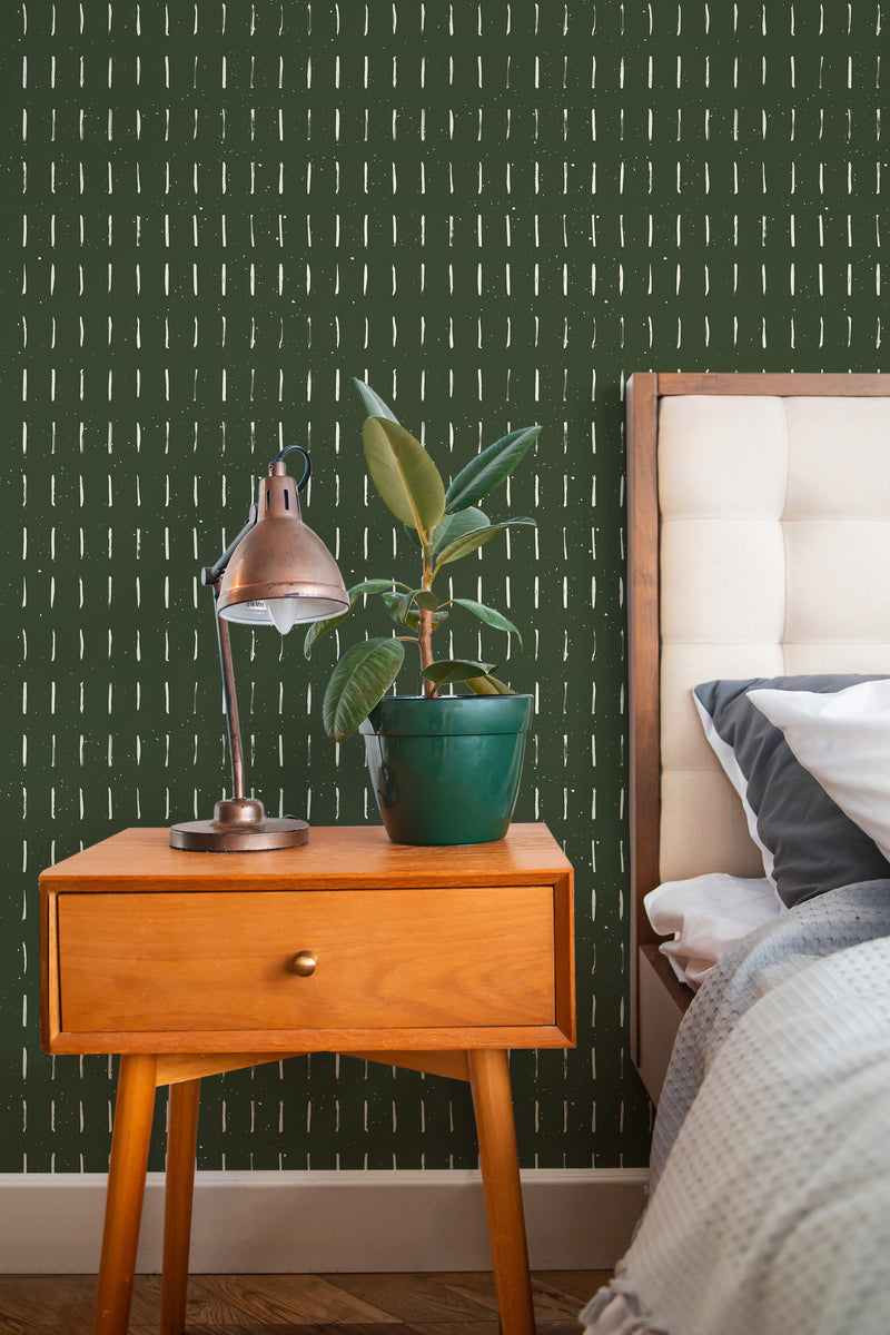 stylish bedroom interior nightstand plant lamp earthy green brush strokes accent wall
