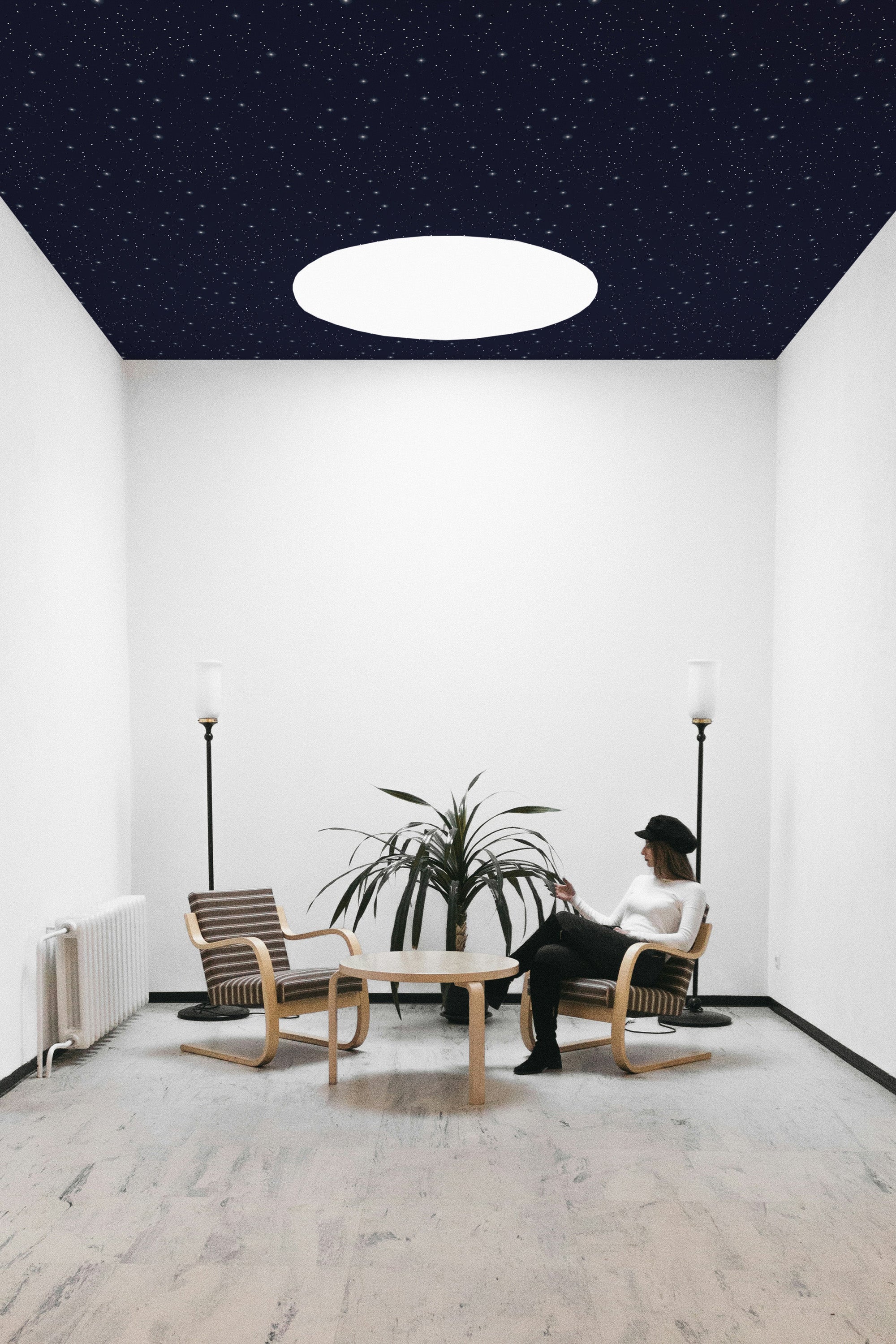 Living room with star ceiling wallpaper.