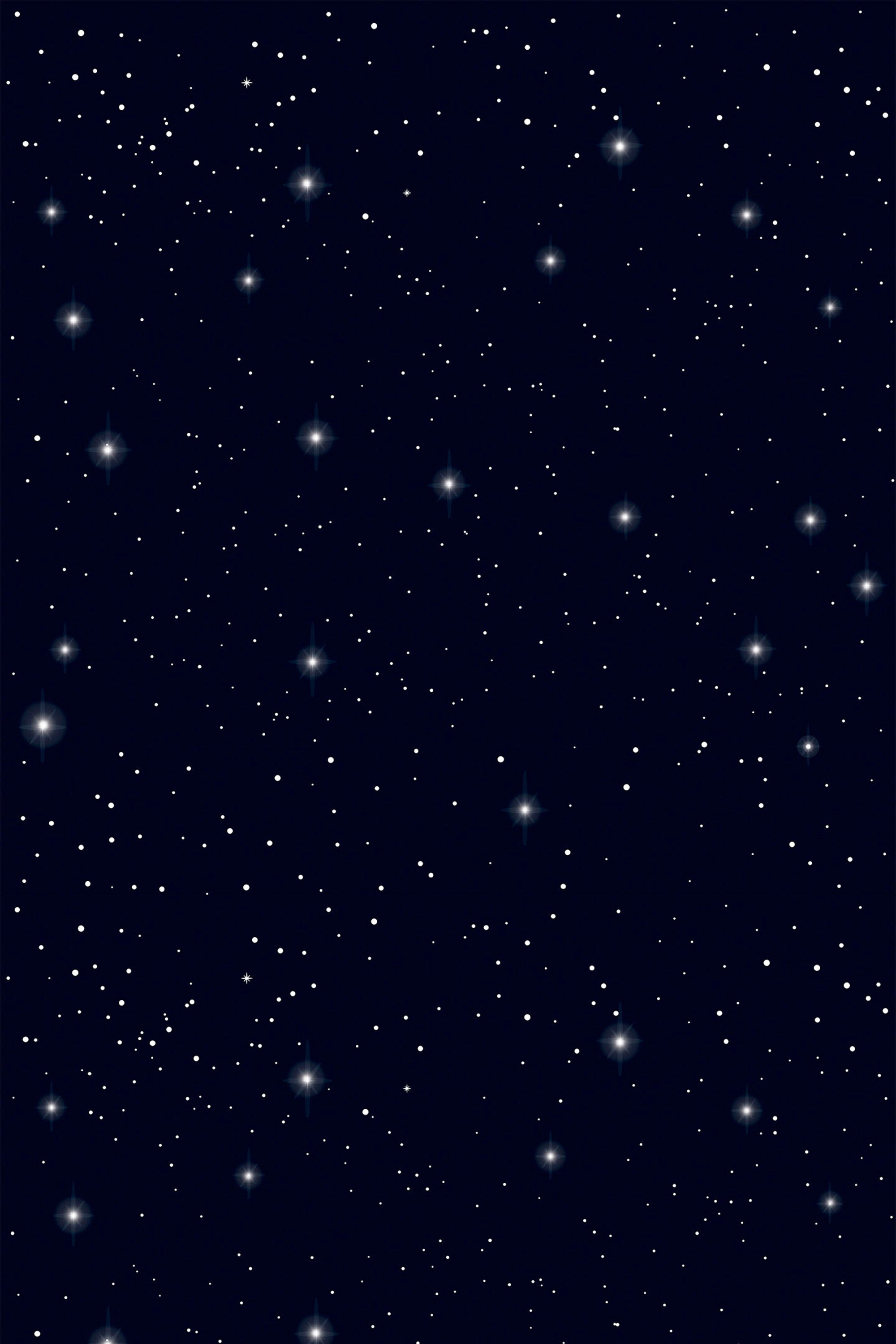 Starry night sky with numerous small white stars on a dark blue background