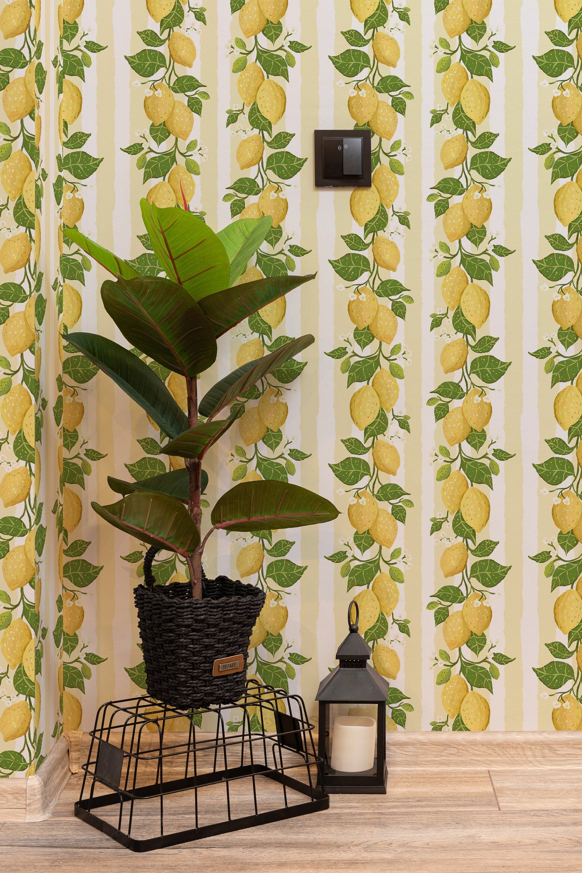 Zesty Lemon Vines peel and stick wallpaper on an interior wall with yellow lemons and green leaves over soft vertical stripes.