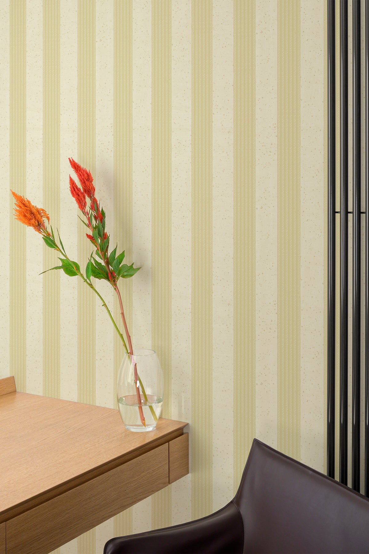 Speckled Stitch Stripe self-adhesive wallpaper on an interior wall, vertical pale tan stripes with speckled cream ground.