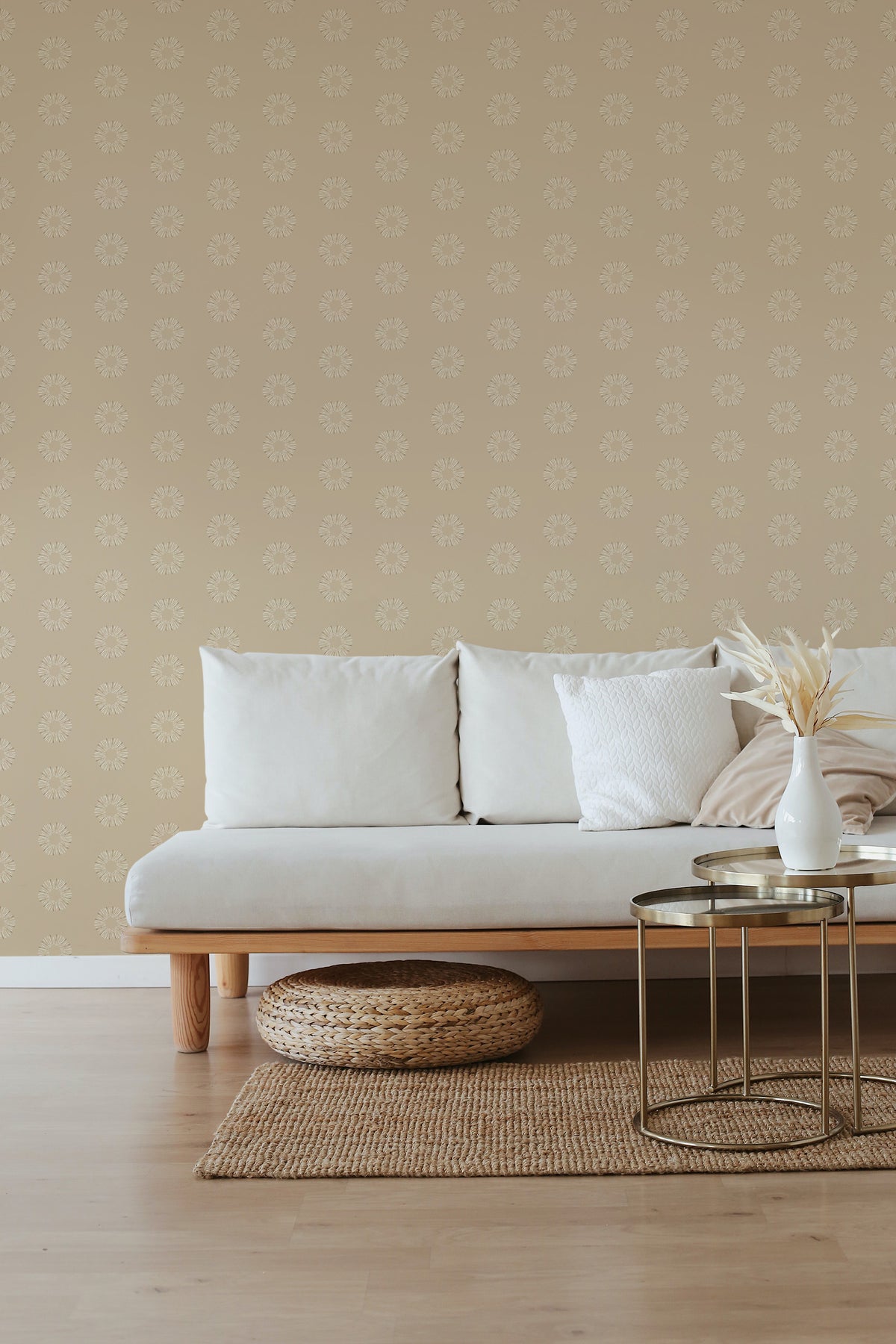 Sunburst Dots self-adhesive wallpaper on a living room accent wall, featuring small white starburst dots on a tan background.