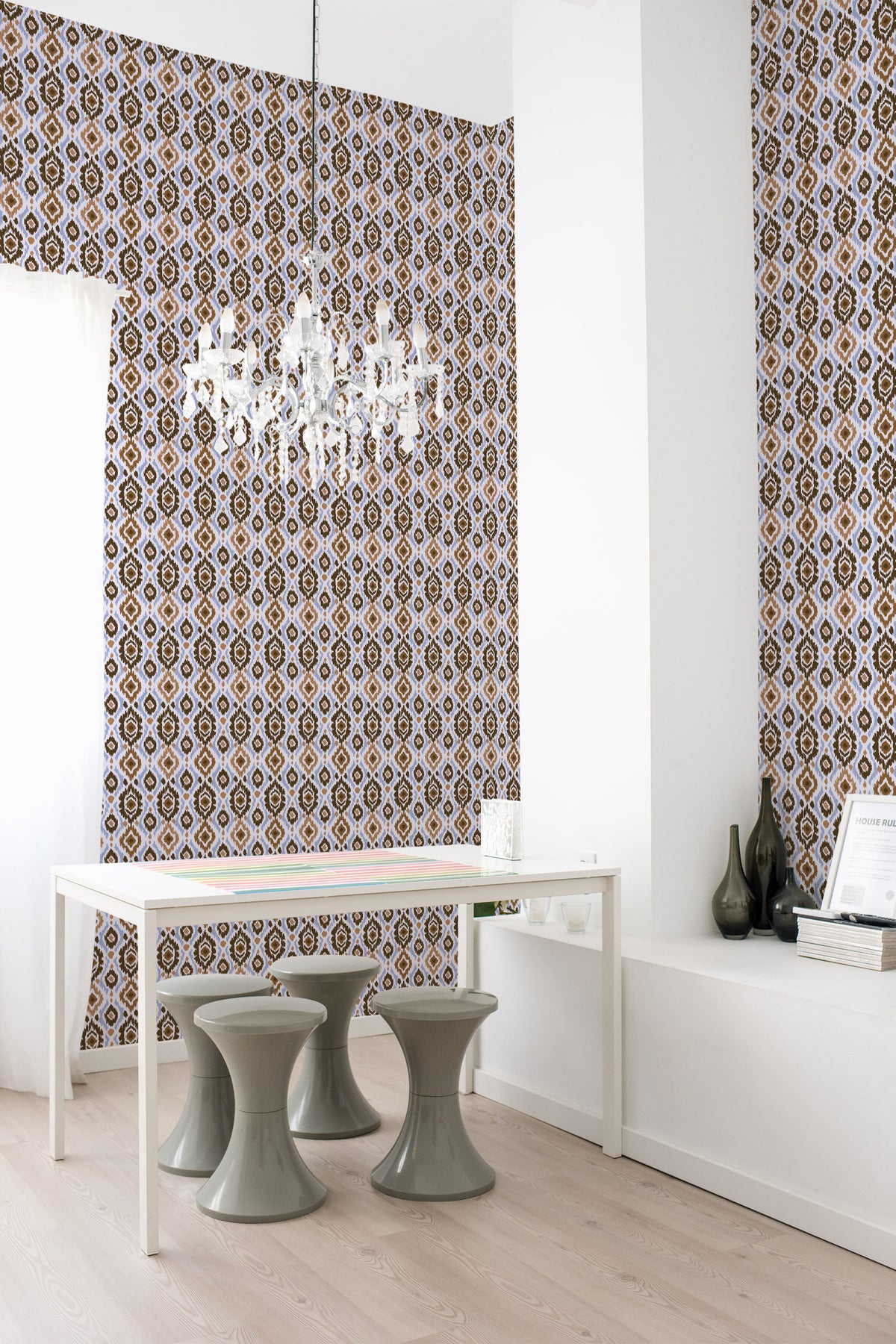 Bold Ikat Medallions self-adhesive wallpaper in a dining room with a full-wall repeat of brown medallions on blue.