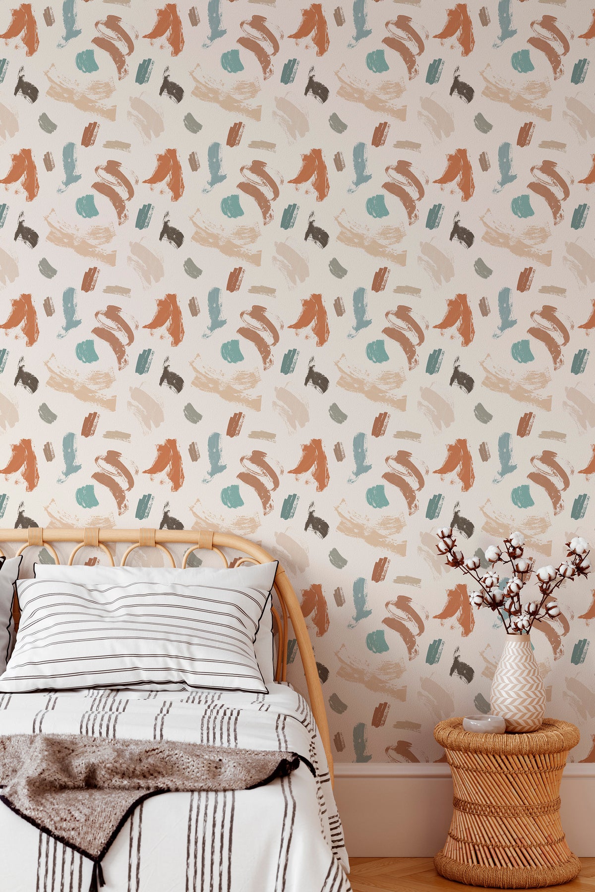 Playful Brush Strokes peel and stick wallpaper in a bedroom, scattered abstract brush marks in muted teal and rust on beige.