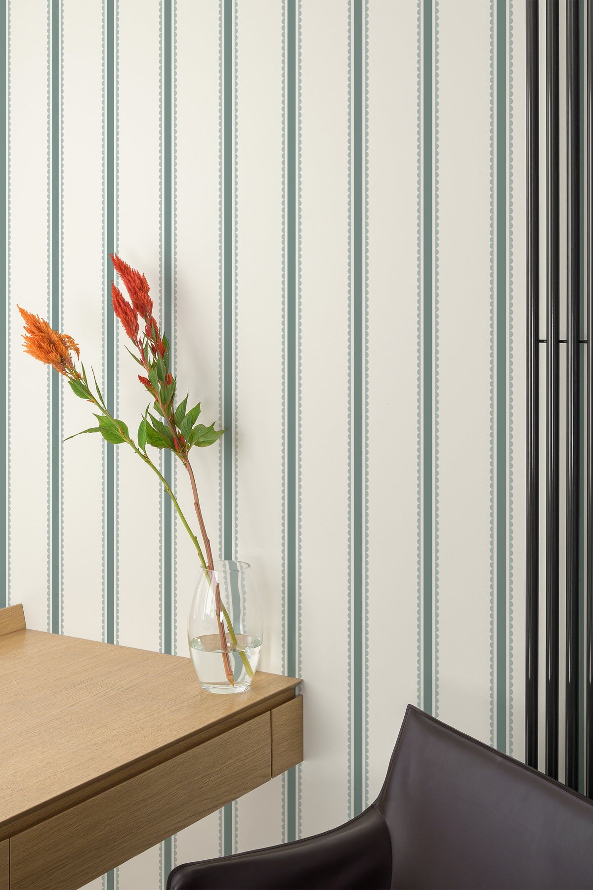 Scalloped Stripe Columns grasscloth wallpaper on an interior wall with vertical blush stripes and green scallops.