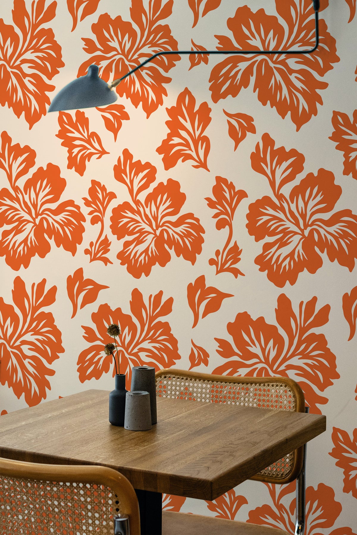 Bold Floral Silhouettes grasscloth wallpaper in a dining room, orange floral silhouettes on warm off-white.