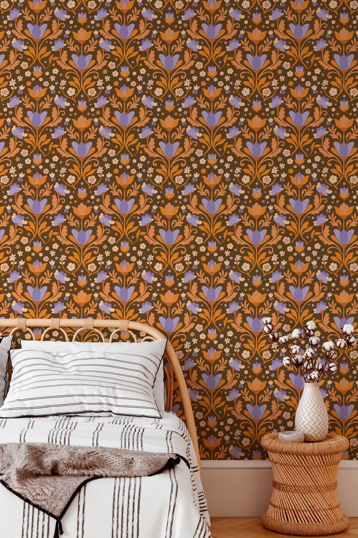 Bold Folk Floral peel and stick wallpaper in a bedroom, full-wall view of purple and orange floral repeat on brown.