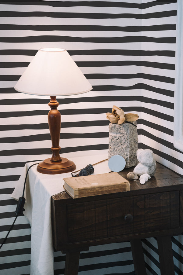 peel and stick wallpaper horizontal lines pattern accent wall bedroom nightstand interior