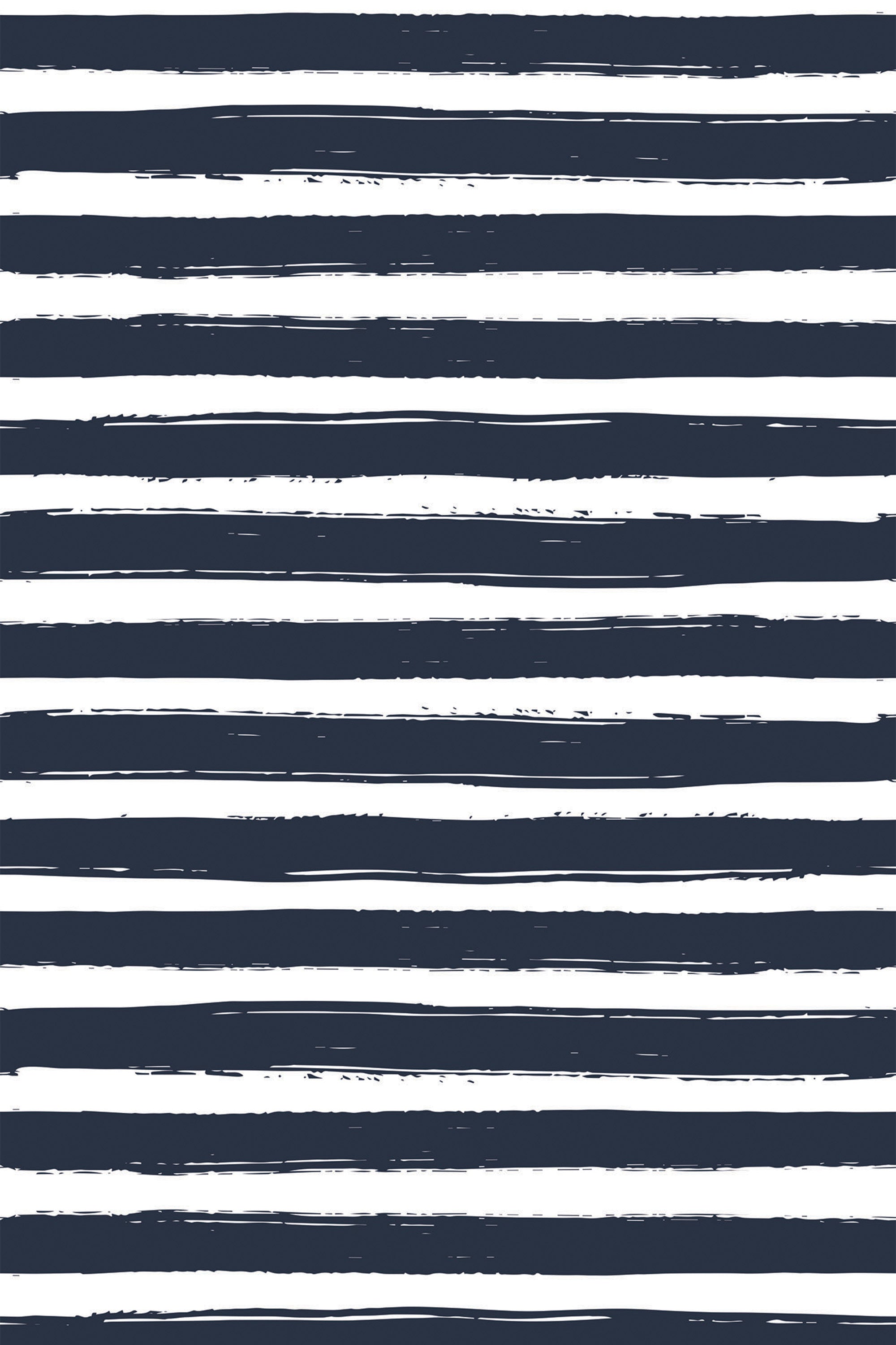 A repeating pattern of irregular, hand-painted dark navy blue brush strokes on a white background, creating a bold, striped effect. Peel and stick removable wallpaper.