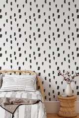 Self-adhesive wallpaper with a minimalist painted lines design in black brushstroke-like shapes, set against a white background, adding a modern and artistic touch to the room.