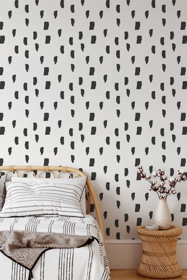 Self-adhesive wallpaper with a minimalist painted lines design in black brushstroke-like shapes, set against a white background, adding a modern and artistic touch to the room.