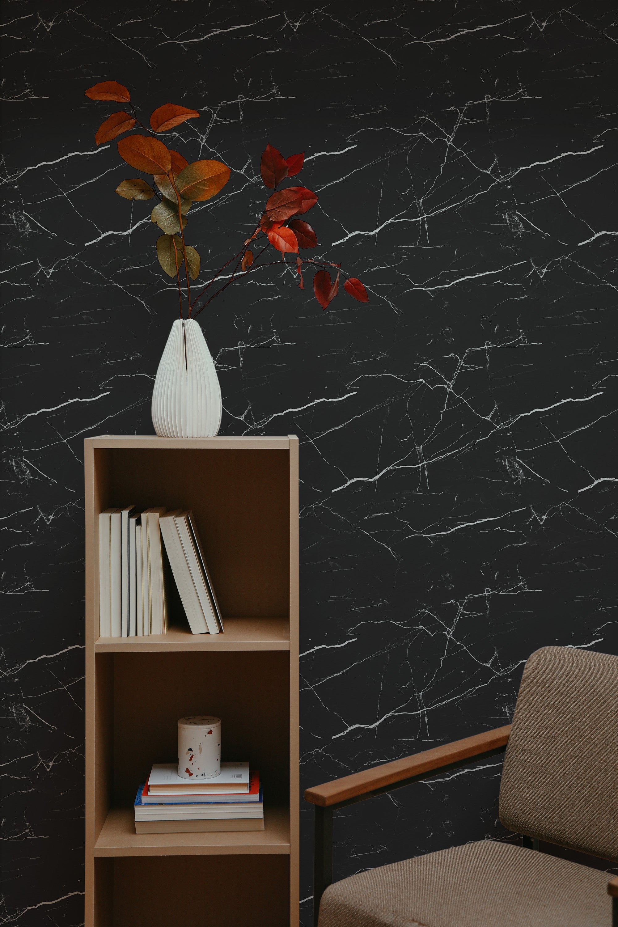 Self-adhesive black marble wallpaper with intricate white veining, creating an elegant and sophisticated backdrop. The dark tones contrast beautifully against lighter room elements, enhancing the contemporary and luxurious feel.