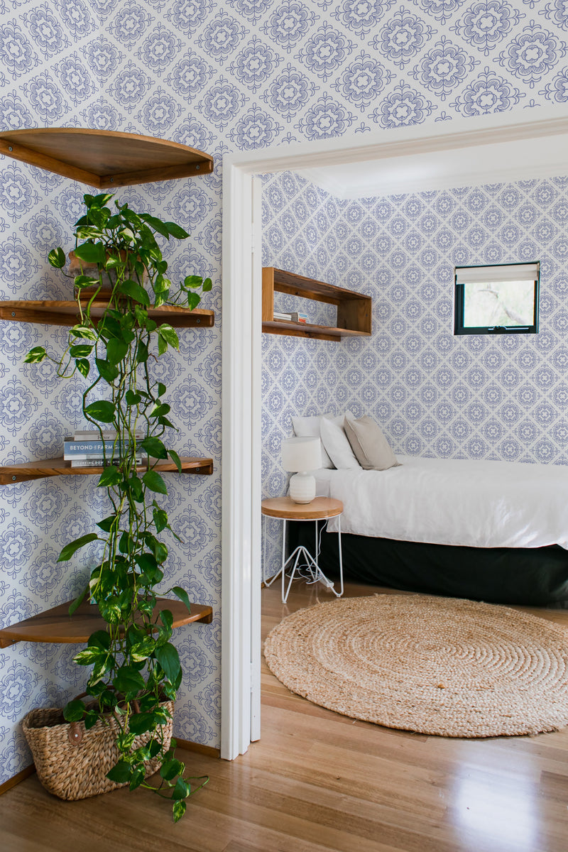 bedroom cozy interior green plants round carpet tiles peel & stick wallpaper