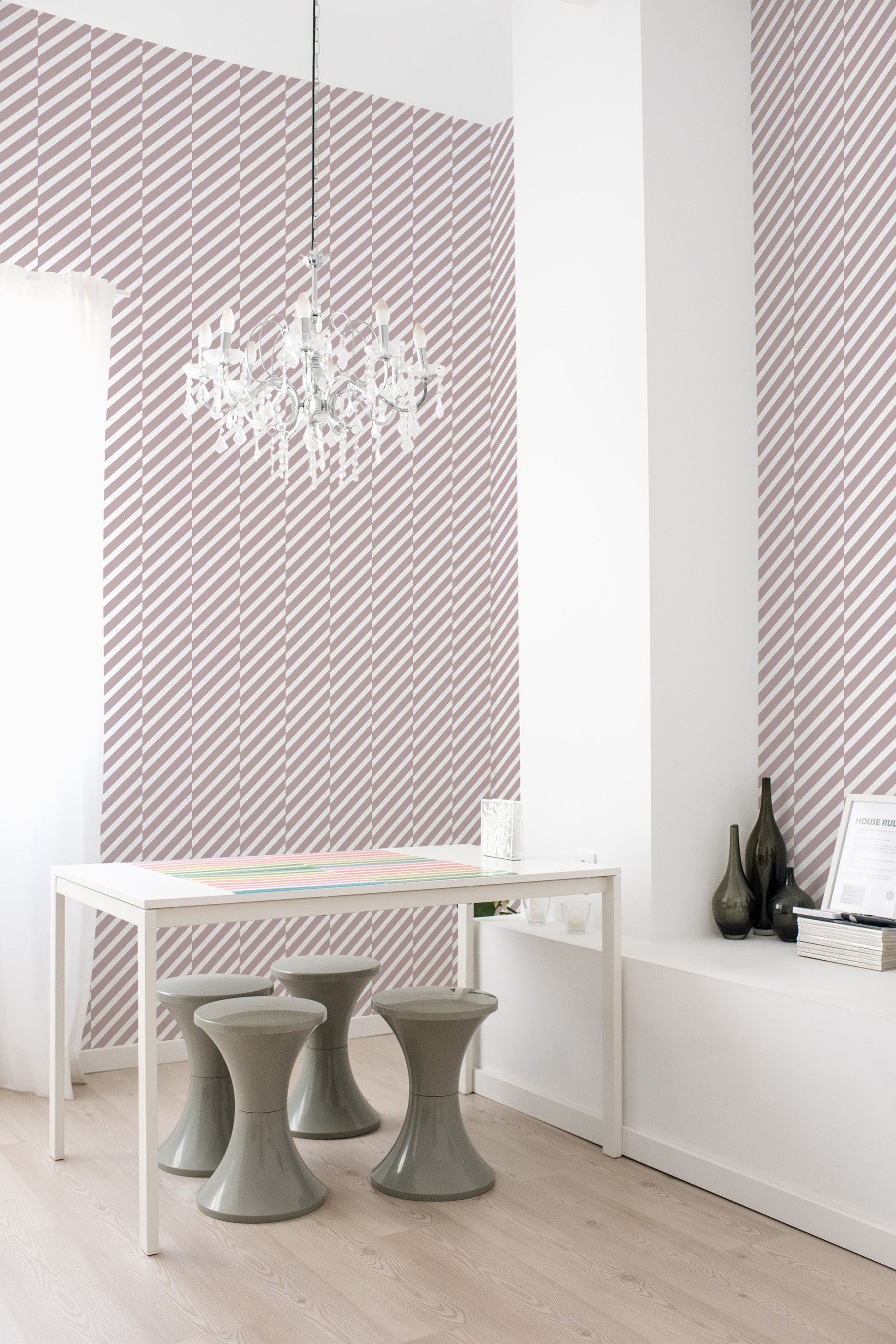 Wallpaper with a diagonal striped pattern in white and muted pink, adding a modern contrast to the room. Traditional wallpaper.