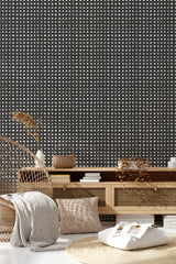 Black wallpaper with a grid pattern of small white squares, creating a geometric, painted effect. Traditional wallpaper.