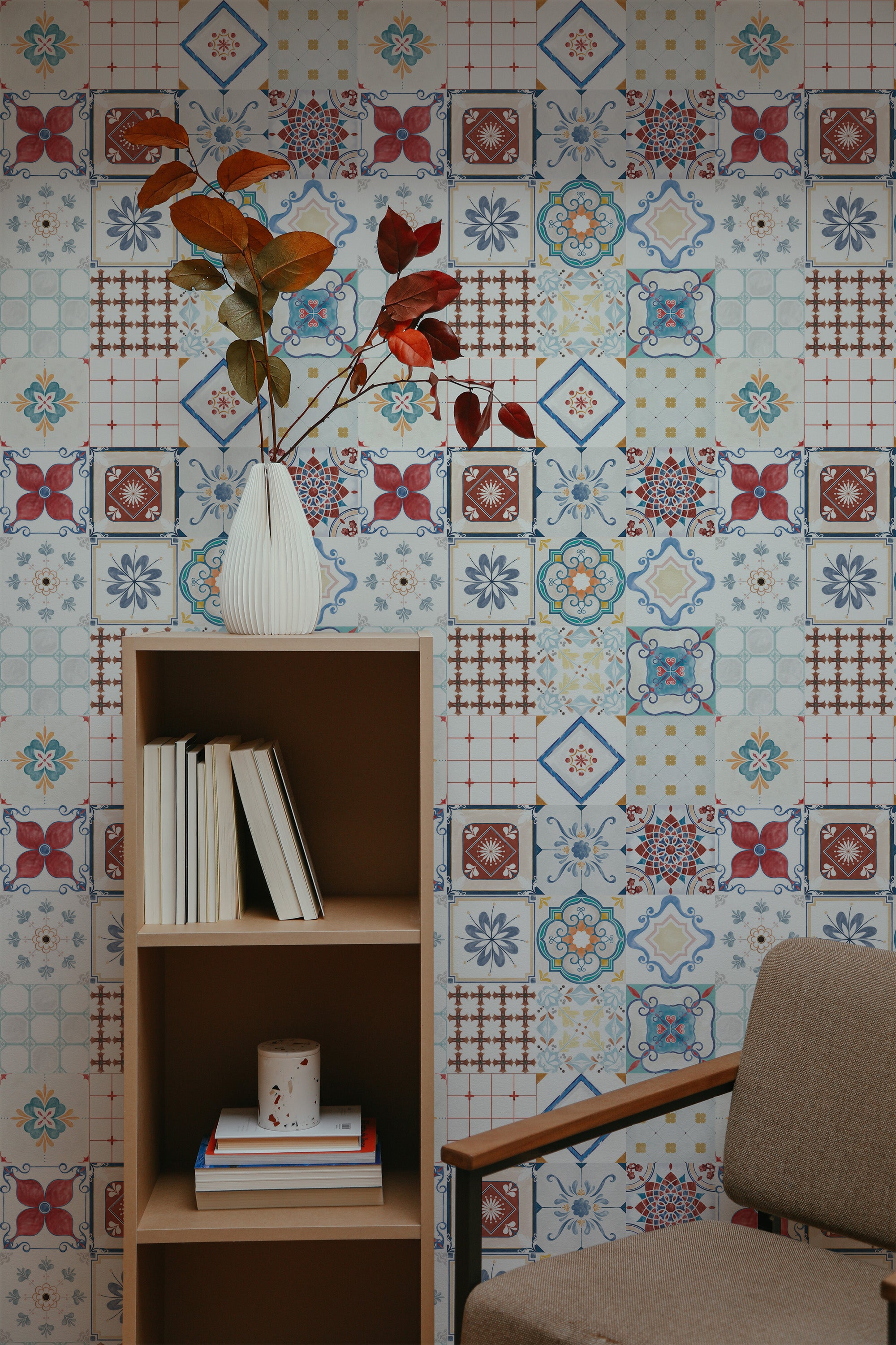 Self-adhesive wallpaper with a colorful tile design in various patterns, including floral and geometric shapes in shades of blue, red, yellow, and white, giving a vintage feel.