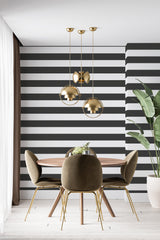 modern dining area velour chair plant black and white wide stripe accent wall