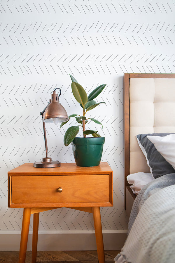 stylish bedroom interior nightstand plant lamp hand drawn herringbone accent wall
