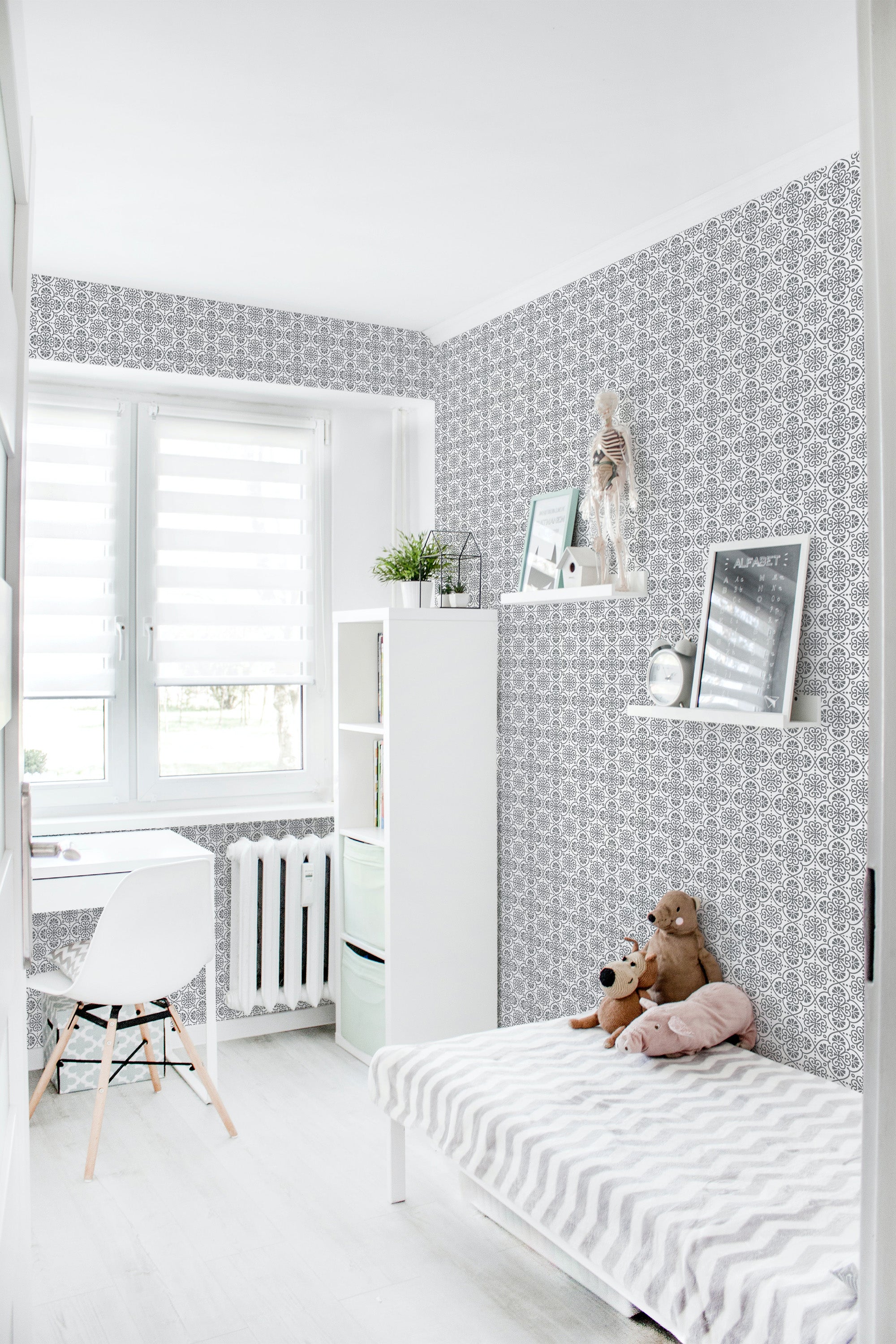A room with black and white patterned wallpaper featuring intricate geometric shapes inspired by traditional Moroccan designs, creating an inviting and culturally rich atmosphere for the space, traditional wallpaper.