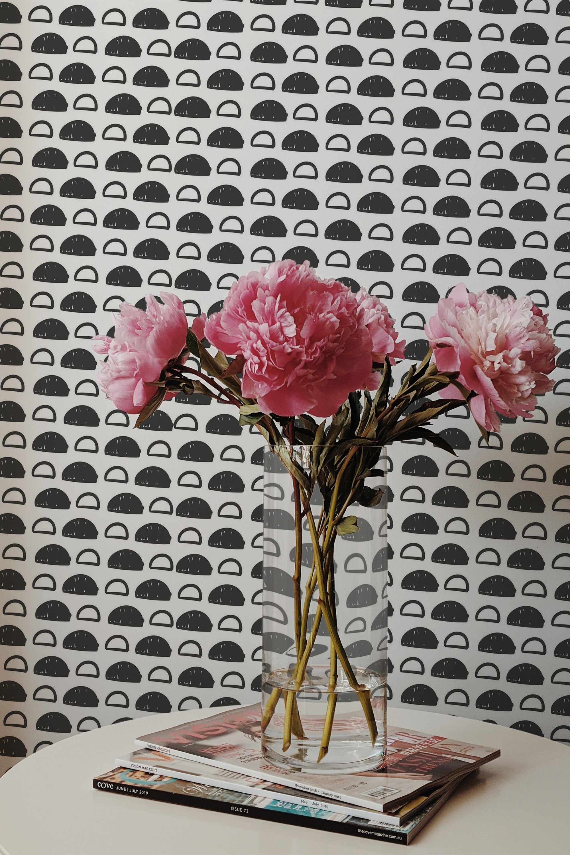 Self-adhesive wallpaper with a black and white abstract circles hand drawing design, resembling half circles or arches with varying patterns, creating a modern and minimalist aesthetic.