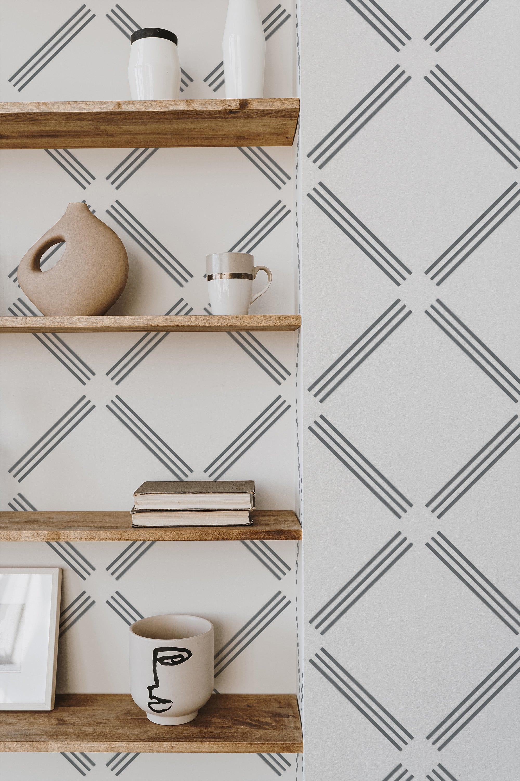Self-adhesive wallpaper with a minimalist tile pattern of intersecting diagonal lines on a light background, creating a clean and contemporary geometric look.