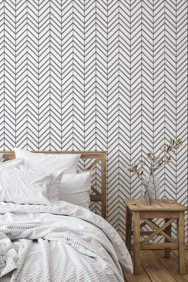 simple bedroom bed nightstand decorative vase geometric herringbone wall decor