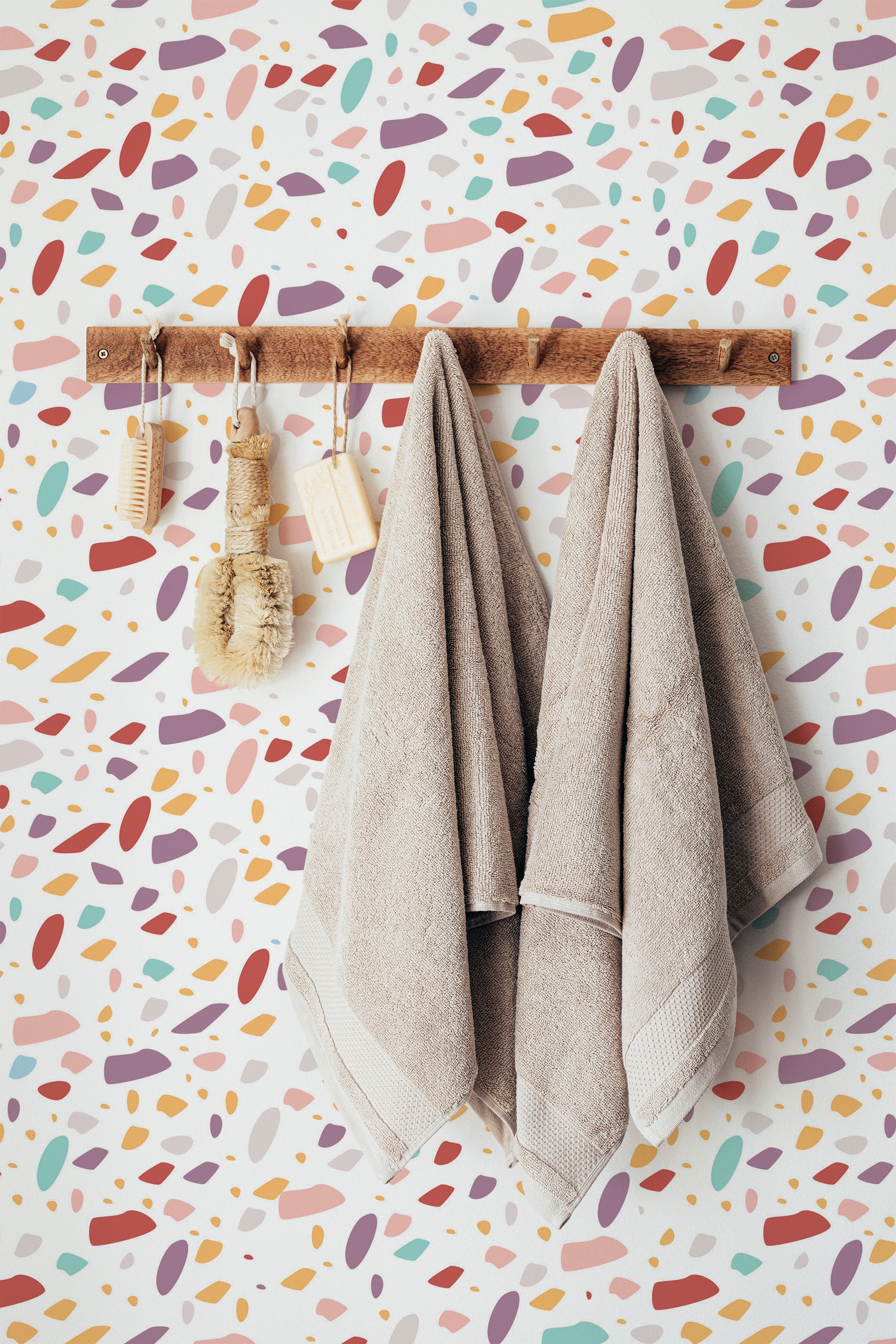 Self-adhesive Colorful Terrazzo wallpaper with a vibrant design of scattered multicolored shapes in pastel and bold tones, creating a playful and modern ambiance in the room.