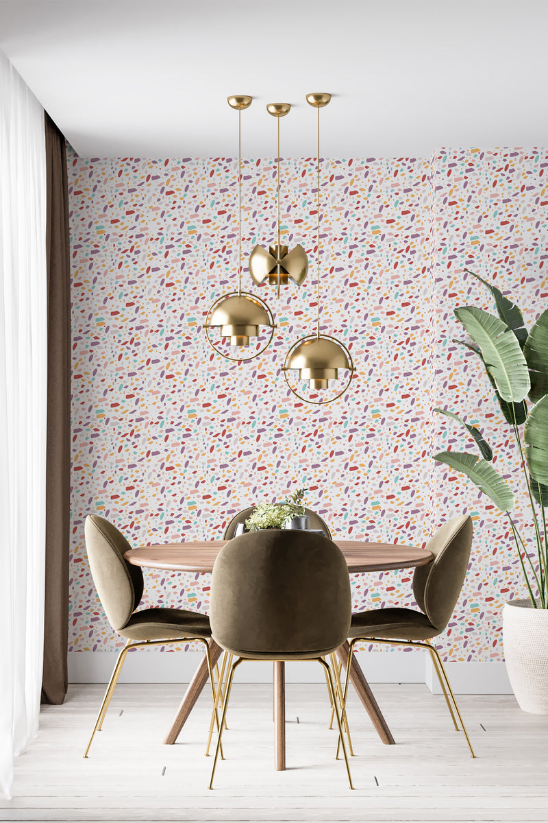 modern dining area velour chair plant colorful terrazzo accent wall