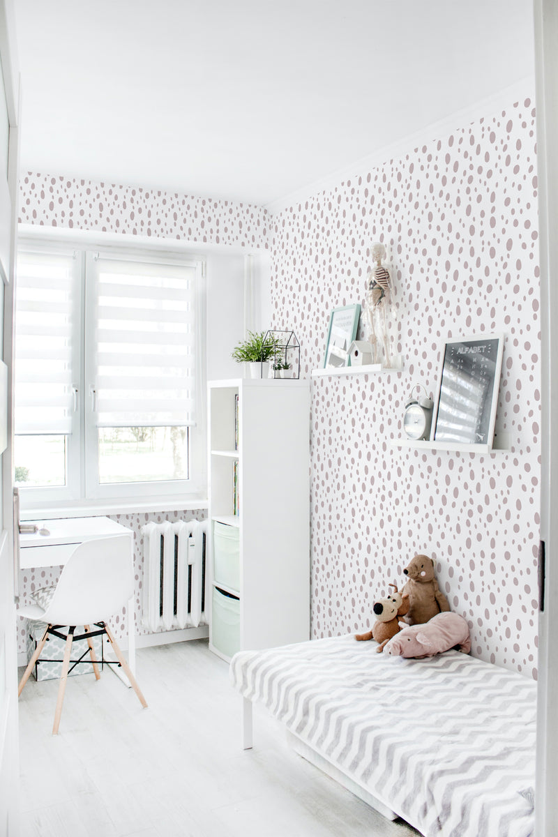 A room with a wallpaper design of evenly spaced, small, soft pink dots on a white background. Traditional wallpaper.