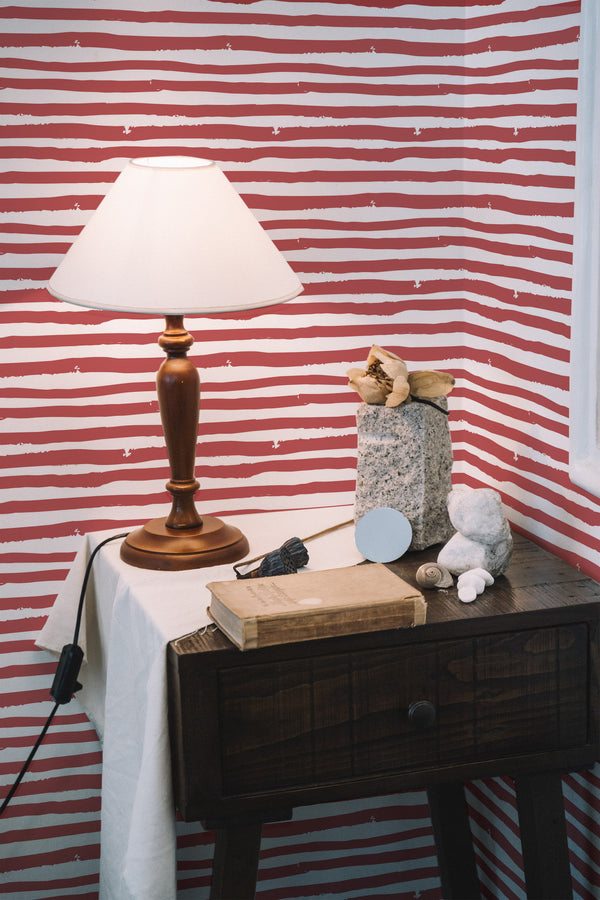 peel and stick wallpaper red painted stripes pattern accent wall bedroom nightstand interior