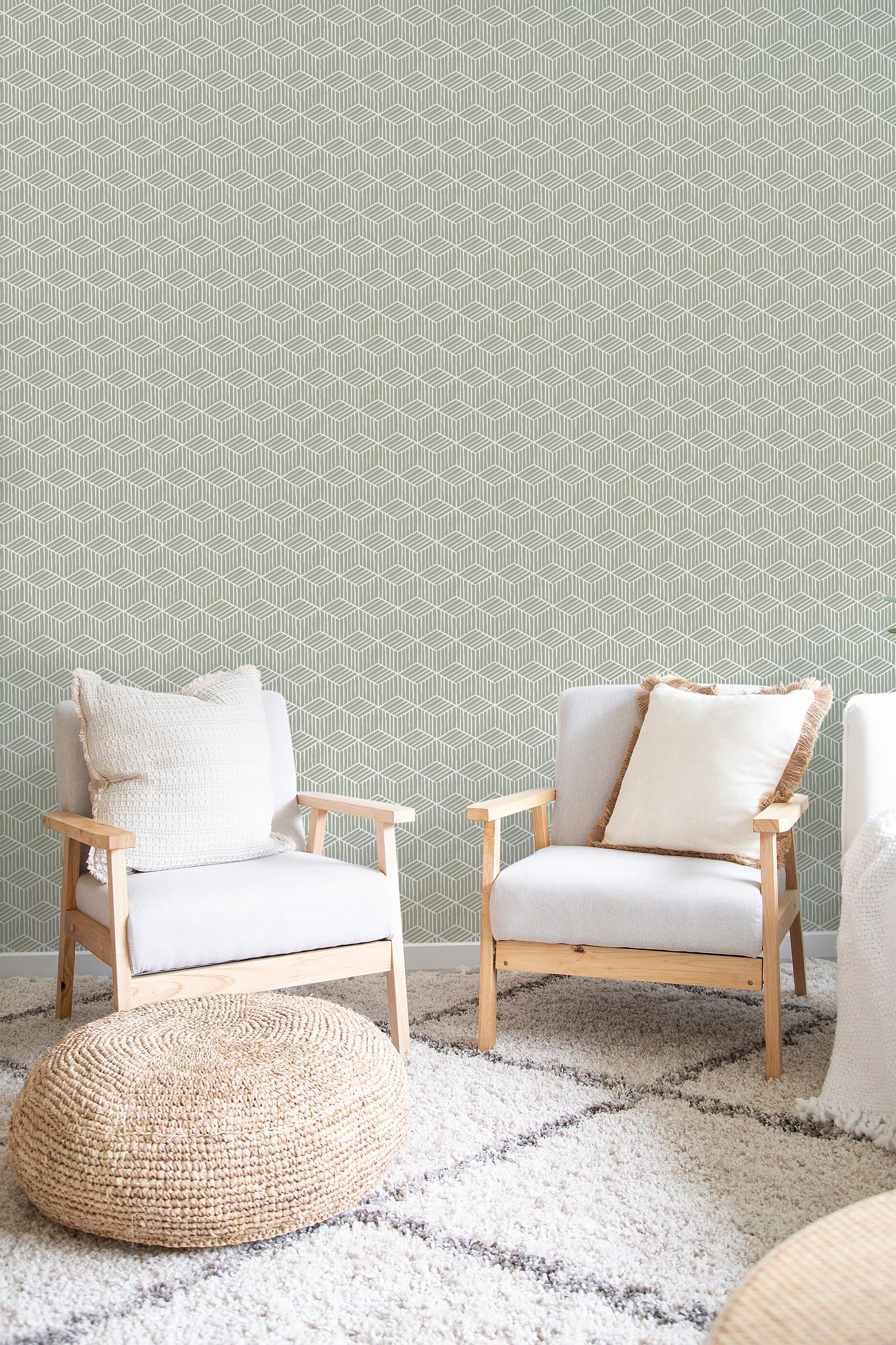 Muted green wallpaper with a repeating geometric pattern of 3D cubes in shades of white and grey, creating an optical illusion effect. Traditional wallpaper.