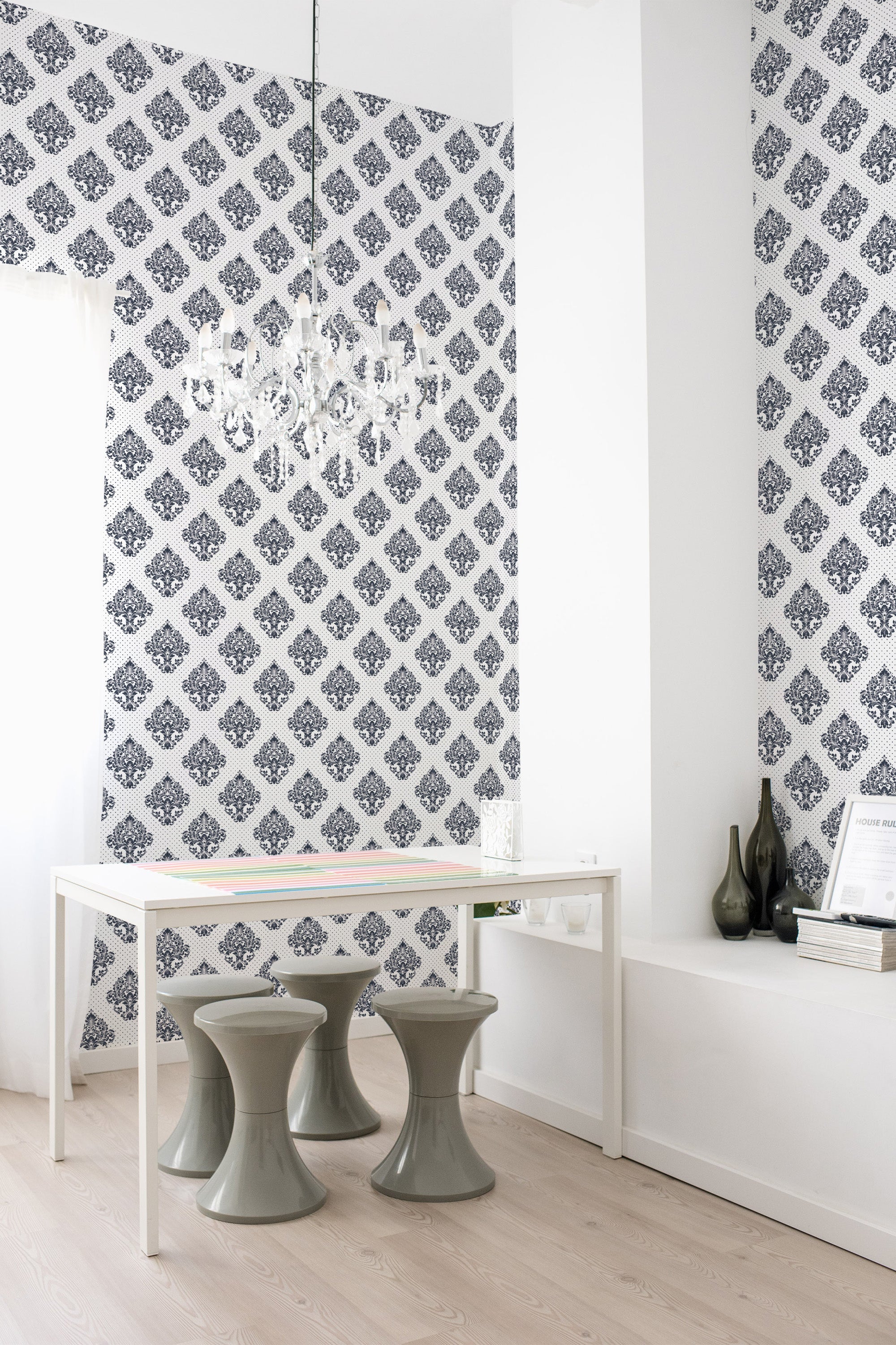 A room with Damask print wallpaper in a repeating pattern of ornate floral motifs on a white background, creating an elegant and sophisticated atmosphere. Traditional wallpaper.