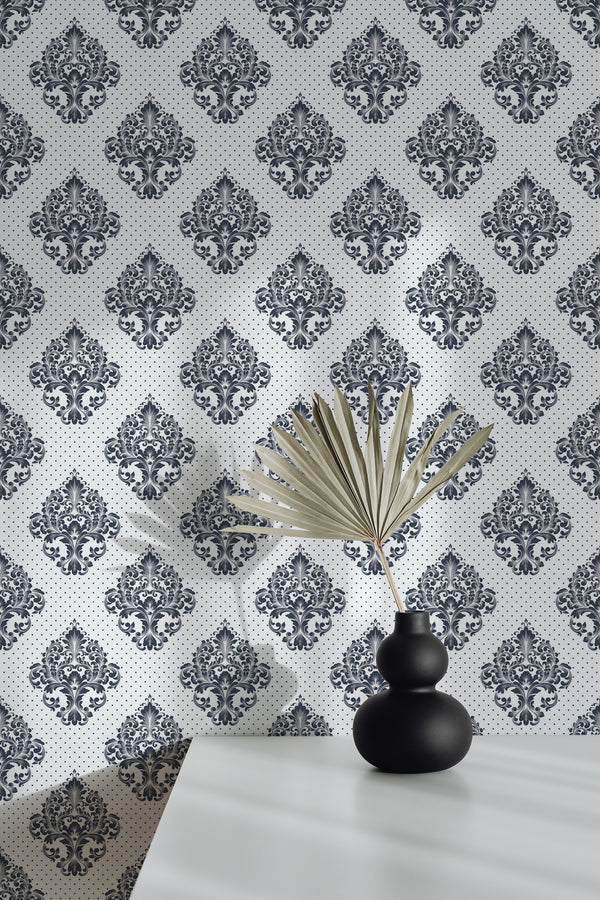 Self-adhesive wallpaper with a Damask print in black on a white background, featuring an intricate pattern of ornate motifs arranged in a vertical, symmetrical layout.